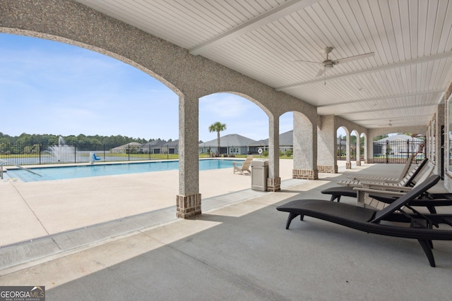 125 The Villas Way, Kingsland, GA 31548 - view of patio / terrace featuring a ceiling fan, a community pool, and fence