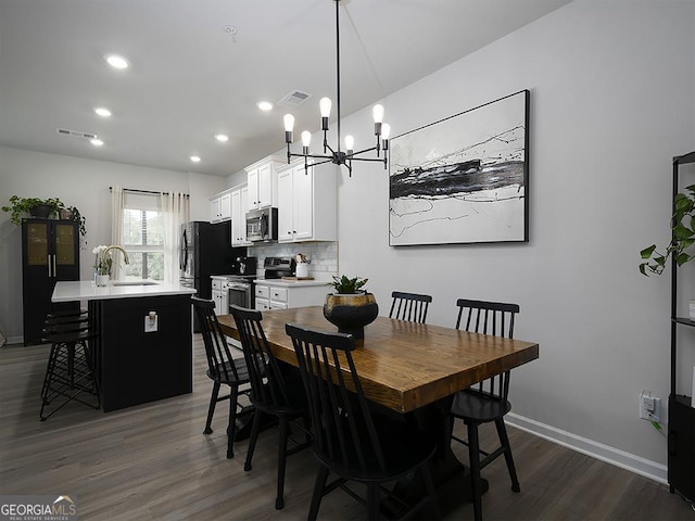 2108 Remy Ct, Kennesaw, GA 30144 - dining space featuring dark wood-style flooring, a chandelier, baseboards, and recessed lighting