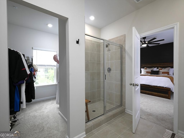 2108 Remy Ct, Kennesaw, GA 30144 - bathroom featuring a stall shower, connected bathroom, a ceiling fan, baseboards, and tile patterned floors