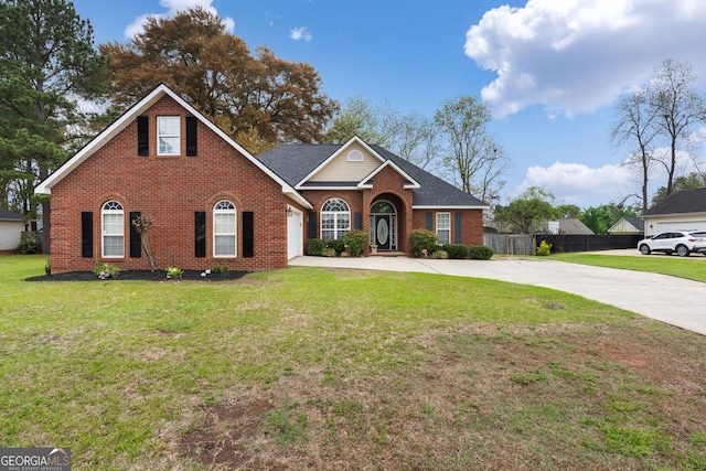 900 Bay Laurel Cir, Warner Robins, GA 31088 - traditional-style home with driveway, brick siding, and a garage