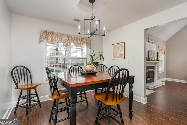 900 Bay Laurel Cir, Warner Robins, GA 31088 - dining room featuring a chandelier, wood finished floors, and baseboards