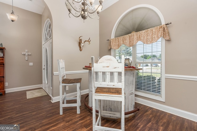 900 Bay Laurel Cir, Warner Robins, GA 31088 - dining room with a chandelier, arched walkways, wood finished floors, and baseboards