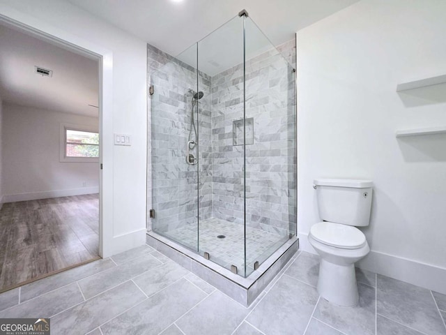 2400 Glenrock Dr, Decatur, GA 30032 - full bath featuring baseboards, a stall shower, toilet, and tile patterned flooring