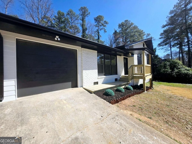 2400 Glenrock Dr, Decatur, GA 30032 - view of front of house with brick siding, concrete driveway, and an attached garage