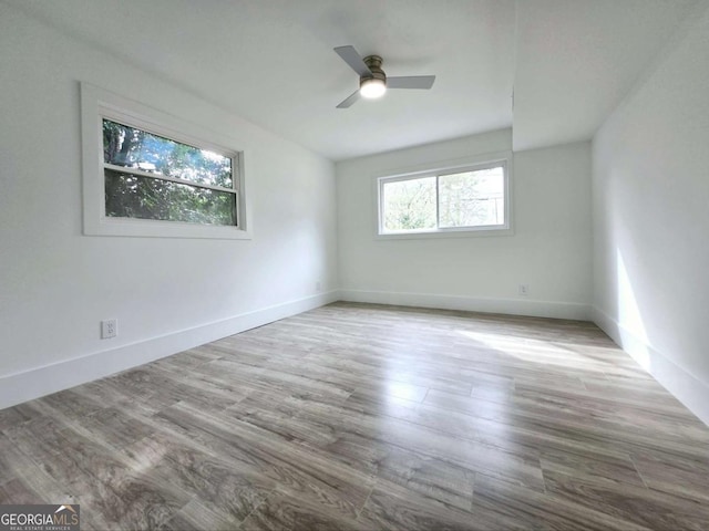2400 Glenrock Dr, Decatur, GA 30032 - empty room featuring ceiling fan, wood finished floors, and baseboards