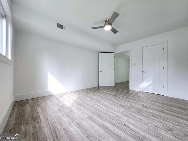 2400 Glenrock Dr, Decatur, GA 30032 - unfurnished bedroom featuring light wood-type flooring, baseboards, and a ceiling fan