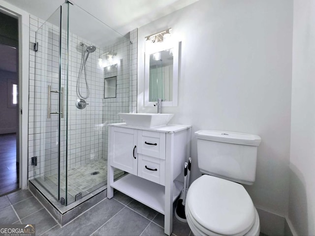 2400 Glenrock Dr, Decatur, GA 30032 - bathroom with a shower stall, tile patterned flooring, toilet, and vanity