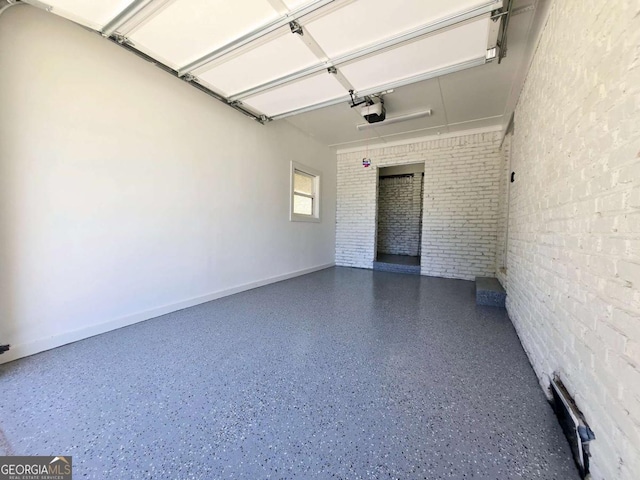 2400 Glenrock Dr, Decatur, GA 30032 - garage featuring baseboards and a garage door opener