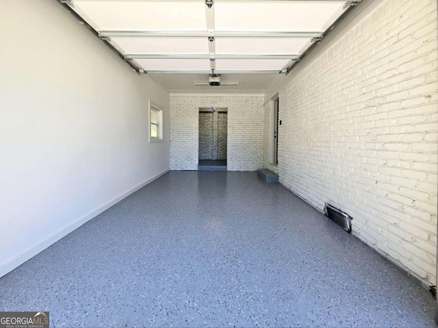 2400 Glenrock Dr, Decatur, GA 30032 - garage with baseboards and a garage door opener