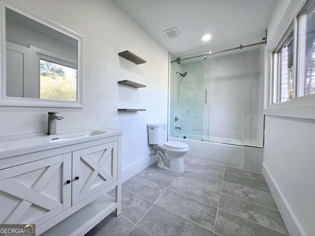 2400 Glenrock Dr, Decatur, GA 30032 - full bathroom with toilet, baseboards, vanity, bath / shower combo with glass door, and tile patterned floors