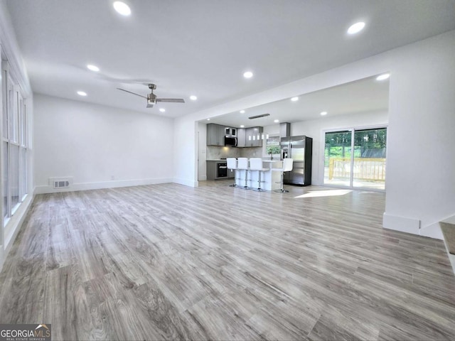 2400 Glenrock Dr, Decatur, GA 30032 - unfurnished living room featuring recessed lighting, light wood-type flooring, a ceiling fan, and baseboards