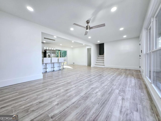 2400 Glenrock Dr, Decatur, GA 30032 - unfurnished living room with ceiling fan, stairs, wood finished floors, baseboards, and recessed lighting