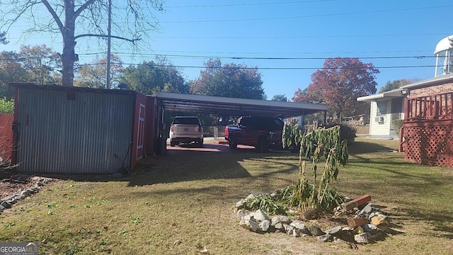 5802 Blueridge Dr, Columbus, GA 31907 - view of grassy yard featuring a detached carport