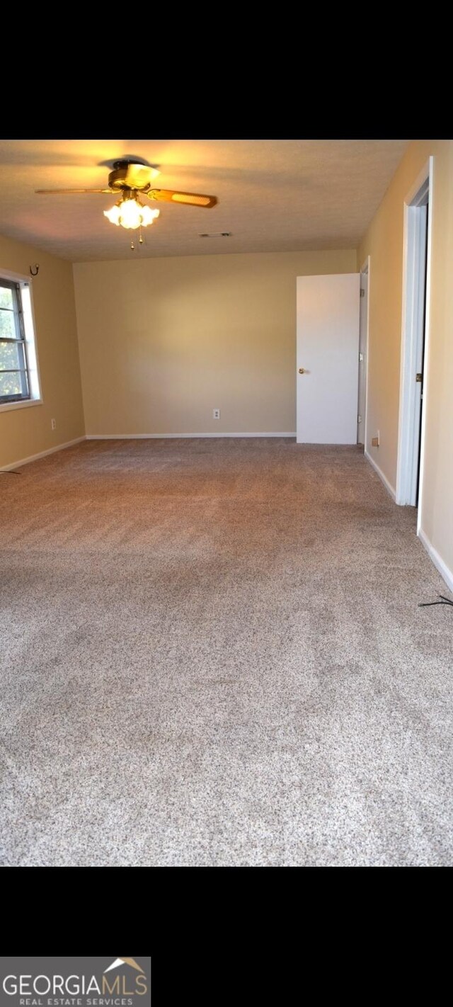 5802 Blueridge Dr, Columbus, GA 31907 - spare room featuring carpet floors, a ceiling fan, and baseboards