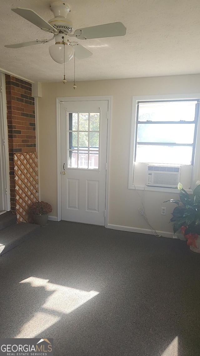 5802 Blueridge Dr, Columbus, GA 31907 - doorway to outside featuring carpet, cooling unit, a ceiling fan, baseboards, and brick wall