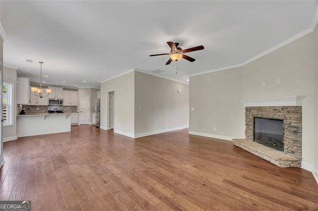 47 Whitley Ct, Dallas, GA 30157 - unfurnished living room with a ceiling fan, dark wood finished floors, crown molding, and baseboards