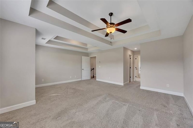 47 Whitley Ct, Dallas, GA 30157 - carpeted spare room featuring a tray ceiling, a ceiling fan, and baseboards