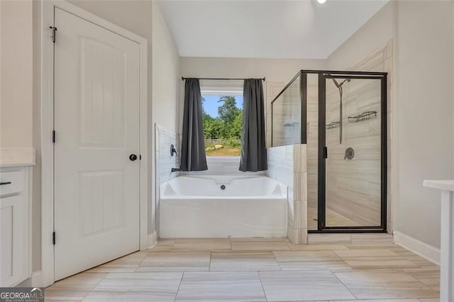 47 Whitley Ct, Dallas, GA 30157 - bathroom with a shower stall, a garden tub, and baseboards