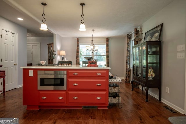 kitchen featuring oven, a chandelier, dark wood-style floors, light countertops, and recessed lighting