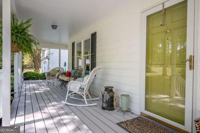 wooden deck featuring covered porch
