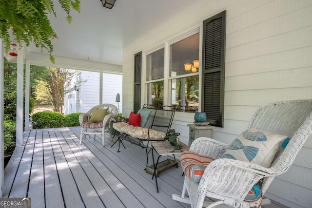 wooden terrace featuring a porch