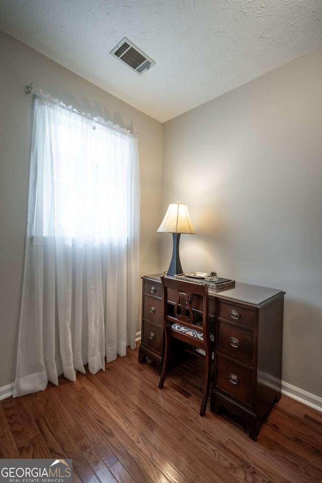 office with wood finished floors and baseboards