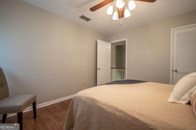 bedroom featuring dark wood finished floors, baseboards, and ceiling fan