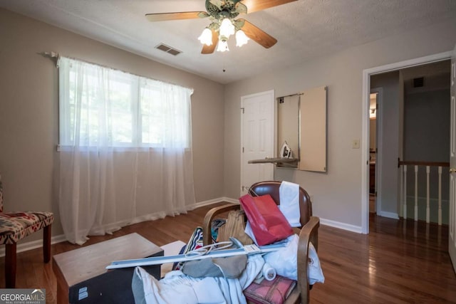 bedroom featuring wood finished floors, baseboards, and ceiling fan