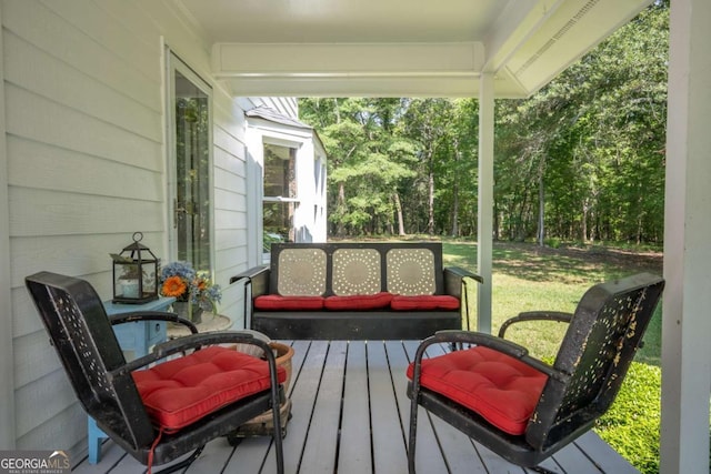 wooden deck featuring a yard