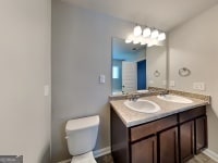 620 Sedona Loop, Hampton, GA 30228 - bathroom with toilet and double vanity