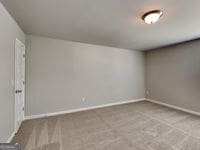 620 Sedona Loop, Hampton, GA 30228 - carpeted spare room featuring baseboards