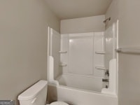 620 Sedona Loop, Hampton, GA 30228 - bathroom with toilet and bathtub / shower combination