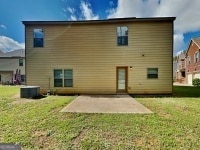 620 Sedona Loop, Hampton, GA 30228 - rear view of house with a patio area and a yard