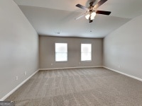 620 Sedona Loop, Hampton, GA 30228 - carpeted spare room featuring baseboards and ceiling fan