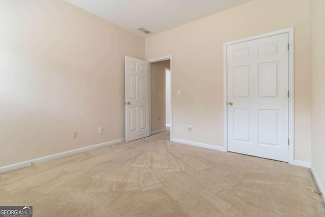 7325 Thoreau Cir, Atlanta, GA 30349 - unfurnished bedroom with carpet floors and baseboards