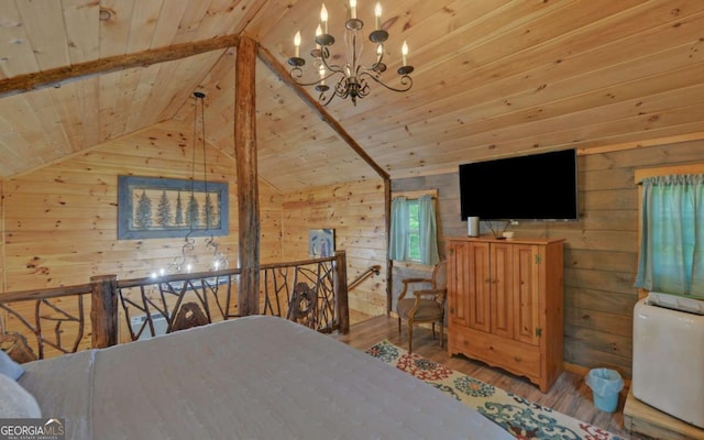 315 Call Wright Rd, Ellijay, GA 30540 - bedroom with wood ceiling, wood finished floors, wood walls, and a chandelier