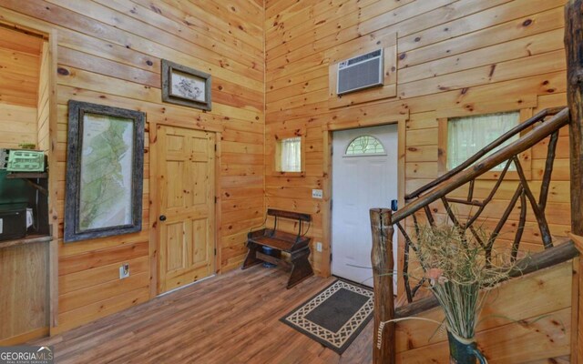 315 Call Wright Rd, Ellijay, GA 30540 - entrance foyer with wood walls, a wall unit AC, wood finished floors, and stairway