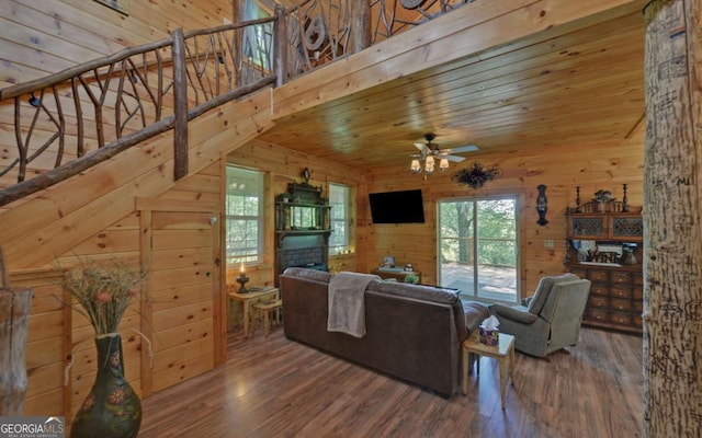 315 Call Wright Rd, Ellijay, GA 30540 - living room featuring ceiling fan, wood finished floors, wooden walls, a fireplace, and wooden ceiling