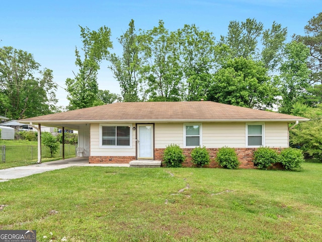 ranch-style home featuring concrete driveway, an attached carport, roof with shingles, and brick siding