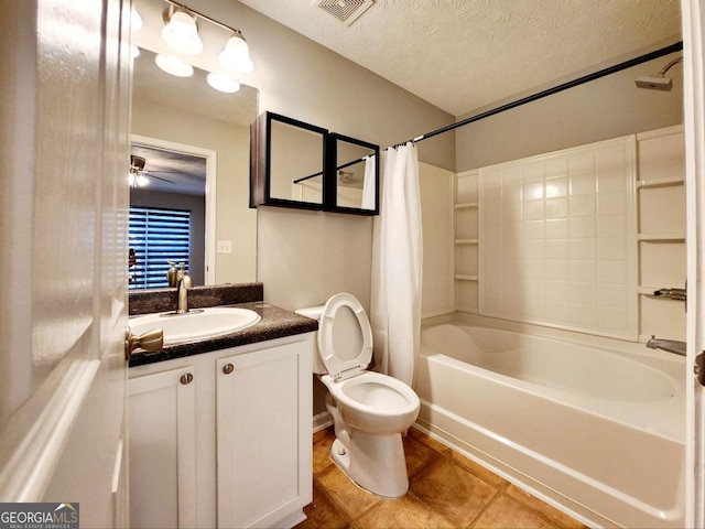 bathroom featuring tile patterned floors, toilet, vanity, shower / bathtub combination with curtain, and a textured ceiling