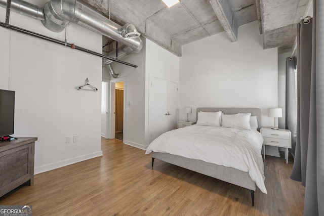 260N 18th St Unit 10326, Atlanta, GA 30363 - bedroom featuring wood finished floors and baseboards
