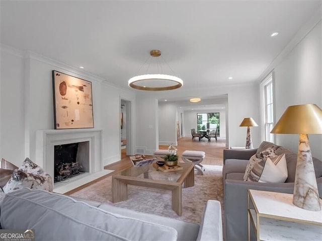 3625 Tuxedo Rd NW, Atlanta, GA 30305 - living room with wood finished floors, a fireplace with flush hearth, crown molding, and recessed lighting