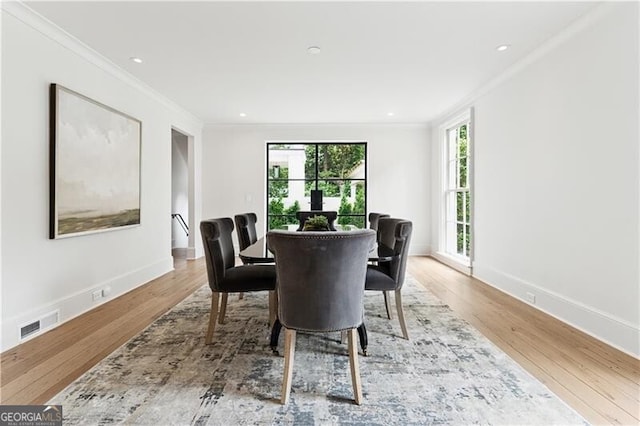 3625 Tuxedo Rd NW, Atlanta, GA 30305 - dining area featuring crown molding, wood finished floors, baseboards, and recessed lighting