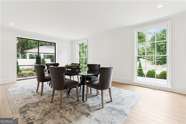 3625 Tuxedo Rd NW, Atlanta, GA 30305 - dining area featuring crown molding, light wood-type flooring, and baseboards