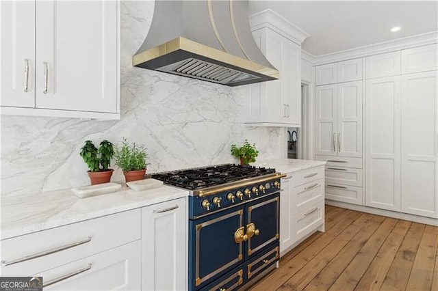 3625 Tuxedo Rd NW, Atlanta, GA 30305 - kitchen with double oven range, ventilation hood, white cabinets, tasteful backsplash, and light wood-type flooring