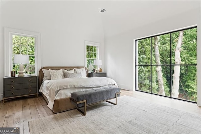 3625 Tuxedo Rd NW, Atlanta, GA 30305 - bedroom with hardwood / wood-style flooring and high vaulted ceiling