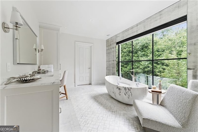 3625 Tuxedo Rd NW, Atlanta, GA 30305 - full bathroom featuring vanity, a freestanding bath, baseboards, and marble finish flooring