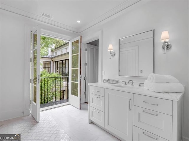 3625 Tuxedo Rd NW, Atlanta, GA 30305 - bathroom featuring ornamental molding and vanity