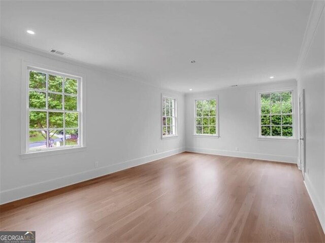 3625 Tuxedo Rd NW, Atlanta, GA 30305 - empty room featuring wood finished floors, baseboards, recessed lighting, and ornamental molding