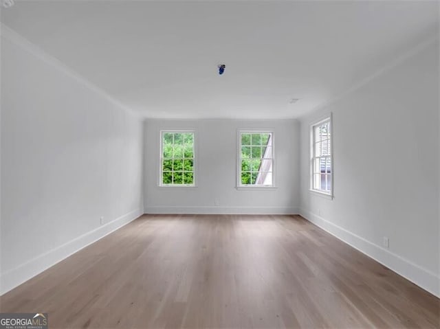 3625 Tuxedo Rd NW, Atlanta, GA 30305 - empty room with wood finished floors, baseboards, and crown molding
